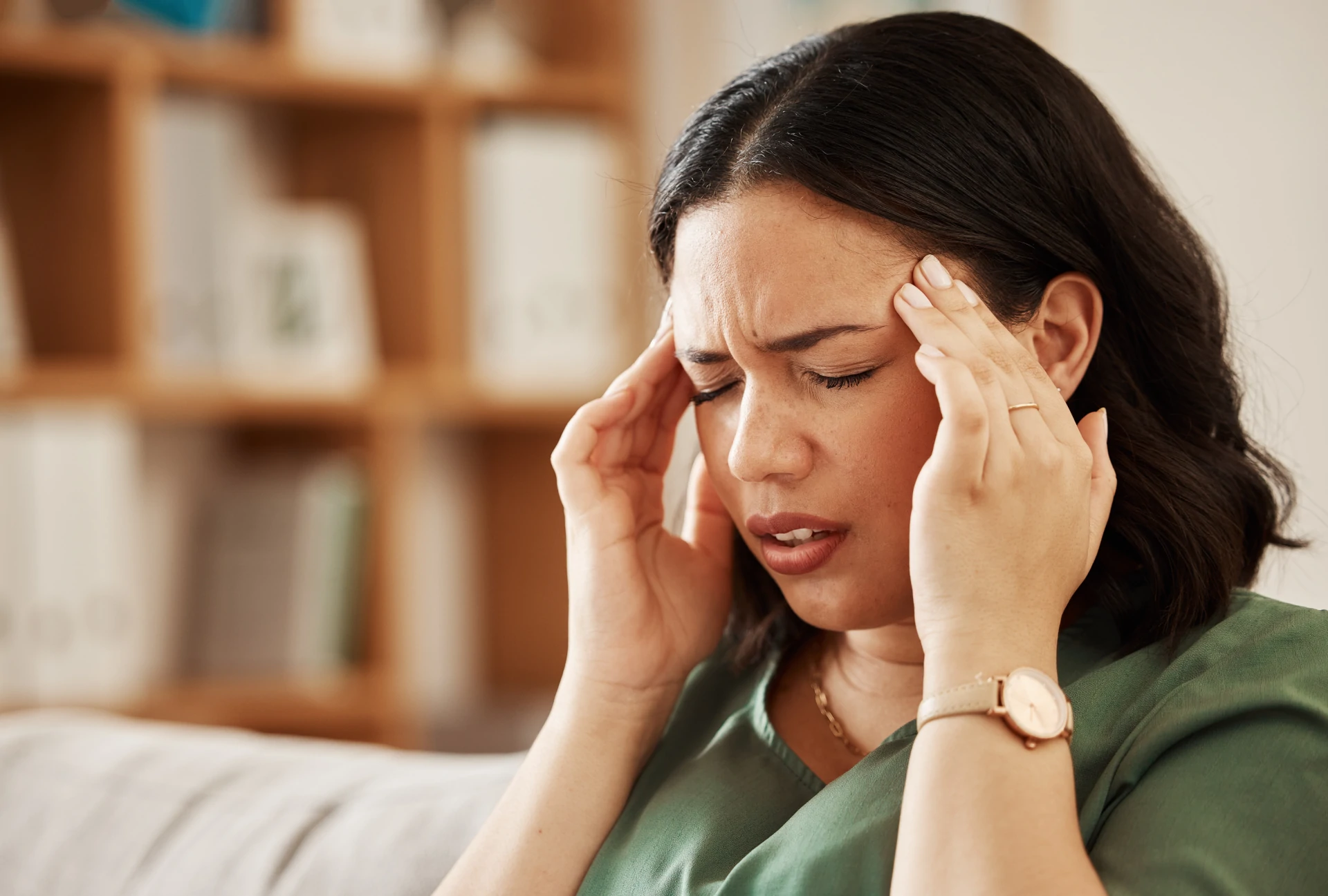 stress-headache-and-woman-on-a-sofa-with-vertigo-2025-04-06-09-28-39-utc